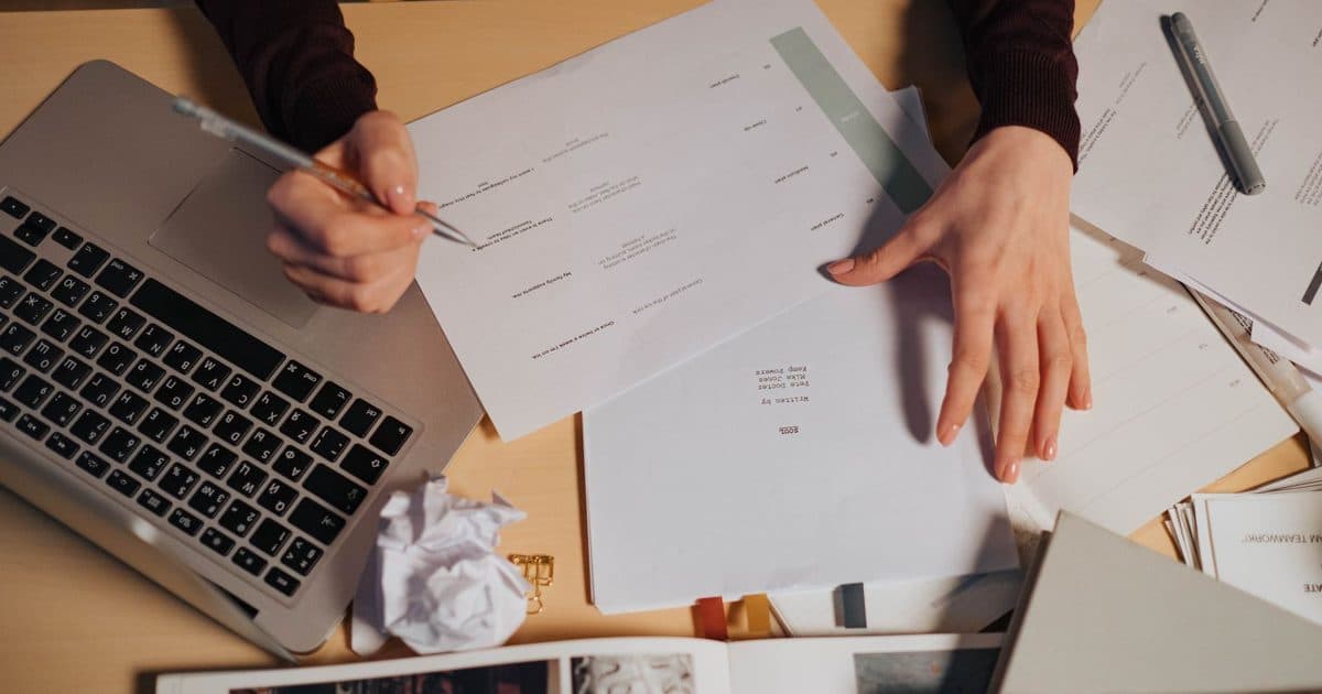 Content editor comparing interview transcript with structured AI brief.