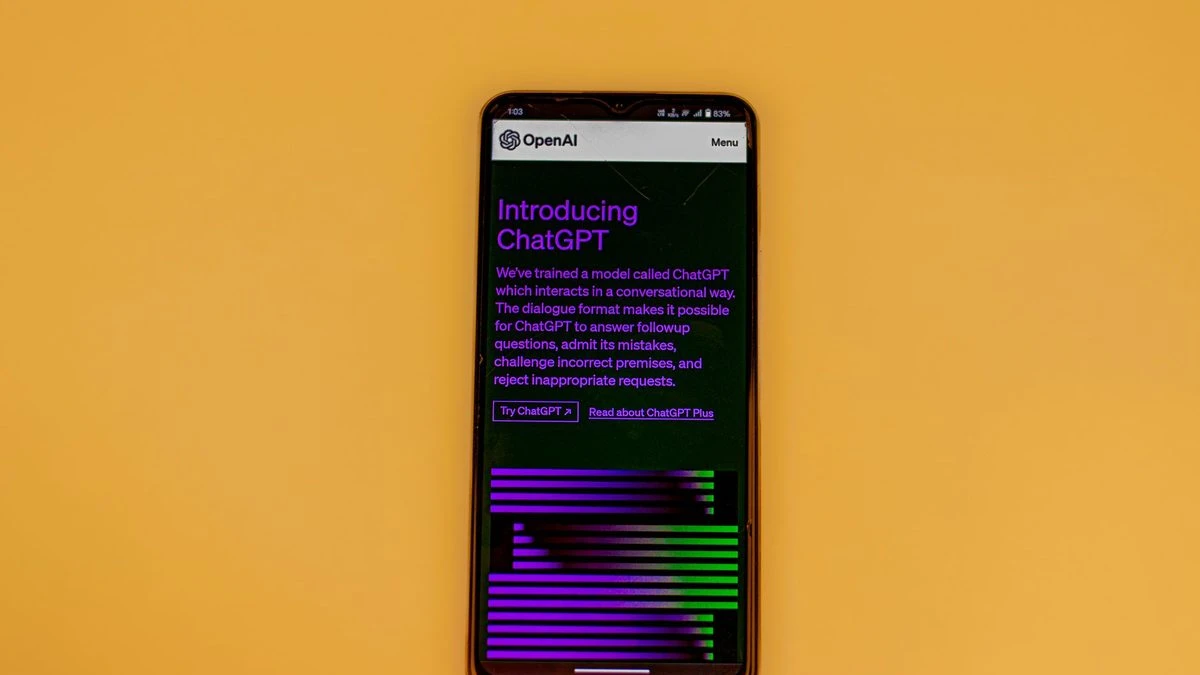 Smartphone displaying ChatGPT interface on a vibrant background, showcasing AI technology.
