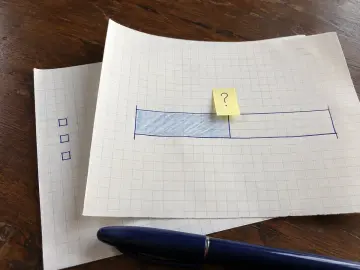 Two adjacent time blocks sketched on graph paper with a question mark at their boundary