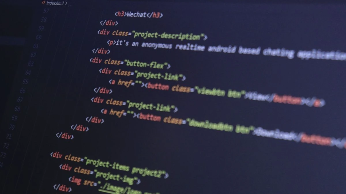 Close-up of HTML code with syntax highlighting on a computer monitor.