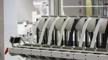 Modern industrial machine in operation in a manufacturing facility showcasing advanced technology.