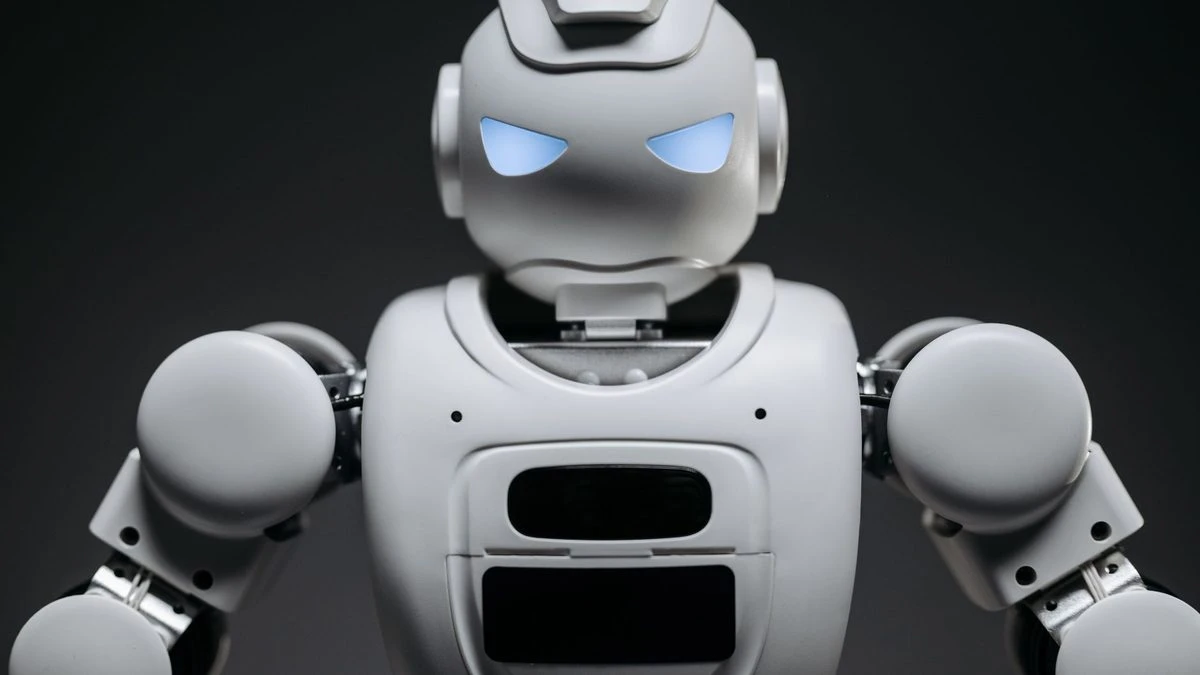 Detailed studio shot of a modern robotic toy with a dark background, showcasing technological design.